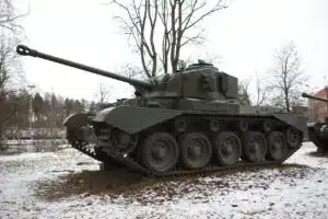 Military tank displayed in snowy environment.