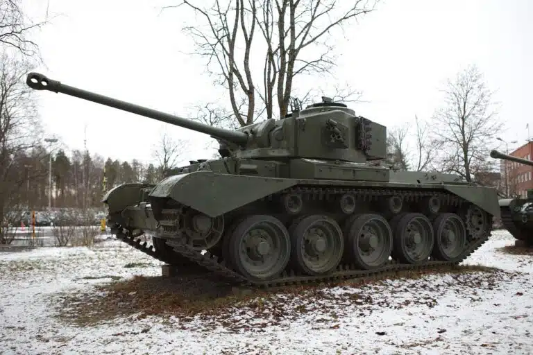 Military tank displayed in snowy environment.