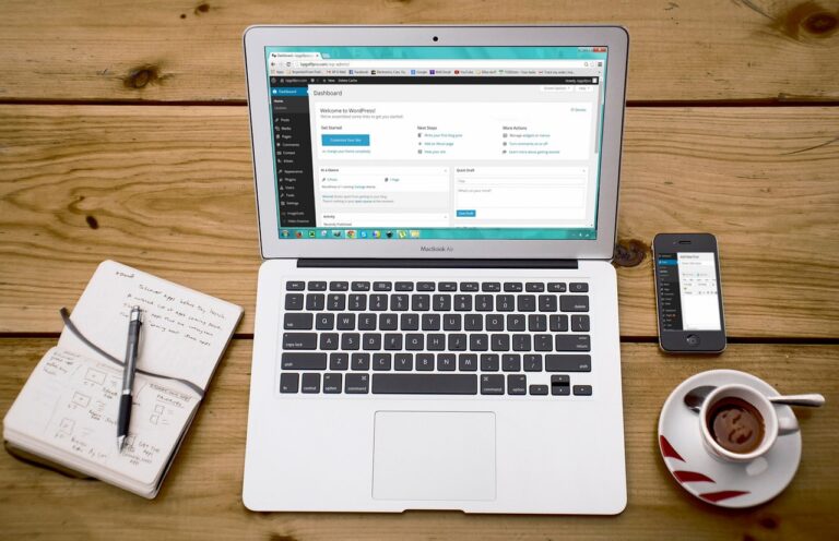 a laptop and phone on a table