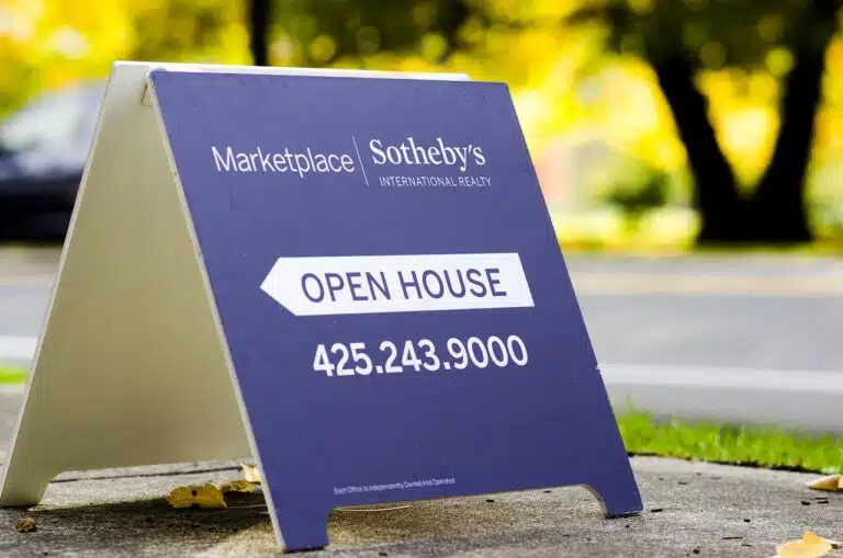 Sign advertising an open house event.