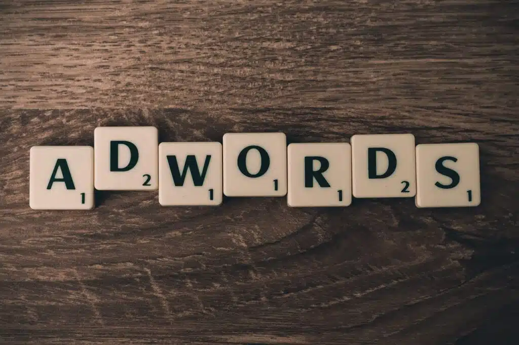 Scrabble tiles spelling 'ADWORDS'
